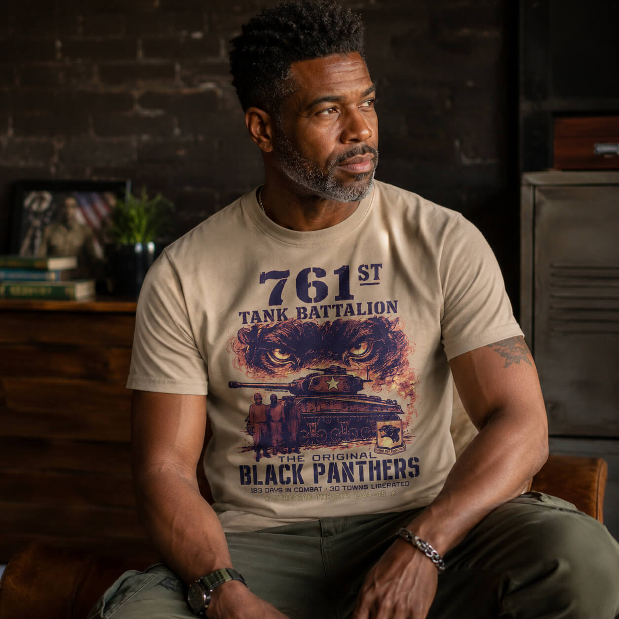 Model wearing beige T-shirt with Black Panthers WWII graphic design
