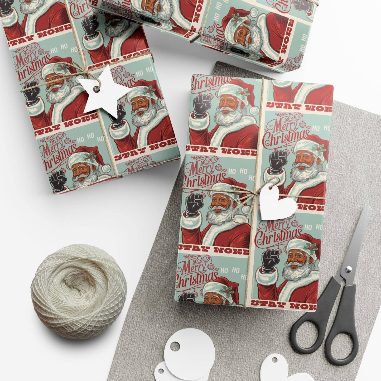 Close-up of gifts wrapped in Black Santa Stay Woke Christmas Gift Wrapping Paper, showcasing vibrant colors and cultural pride for holiday celebrations.