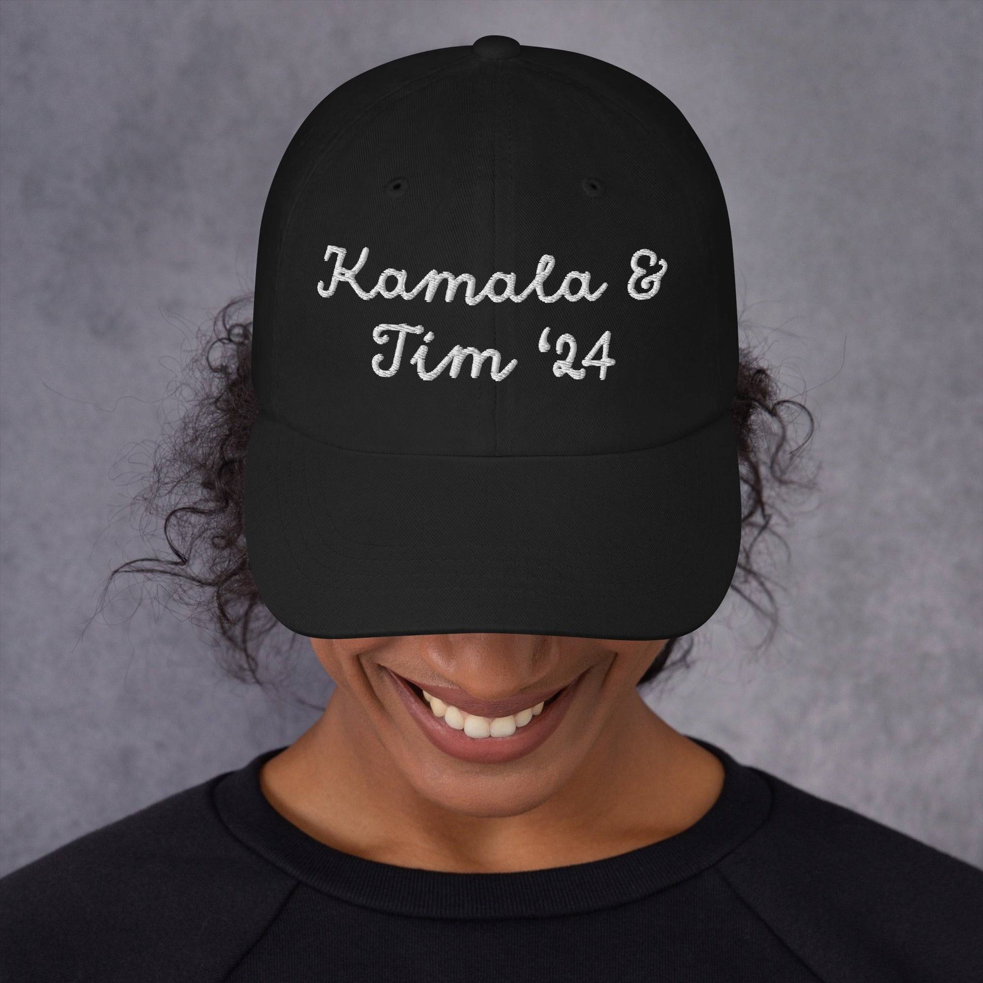 Person wearing black Kamala & Tim '24 embroidered cap