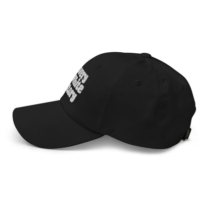 Side profile of black Slavery Is White History Embroidered Dad Hat by TheBlacket Co., showing clean stitching and curved visor design.