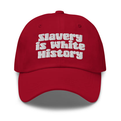Red Slavery Is White History Embroidered Dad Hat by TheBlacket Co. with white embroidered message, perfect for bold fashion statements.