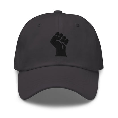 Black On Black Power Fist Embroidered Baseball Cap featuring a bold black fist symbol on a low-profile unstructured cotton twill hat.