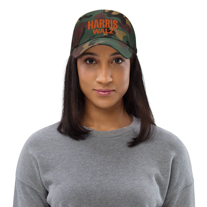 Woman wearing Harris Walz camo hat, front view