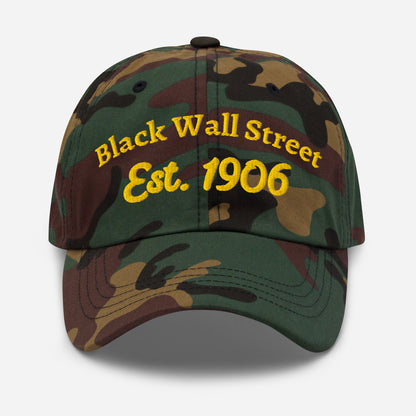 Camo Black Wall Street Est. 1906 Baseball Cap with yellow embroidery, military-style pattern and adjustable fit.