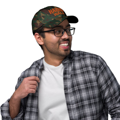 Man wearing Harris Walz camo dad cap, smiling