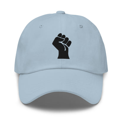 Light blue Black On Black Power Fist Embroidered Baseball Cap with a soft pastel tone and strong embroidered message.