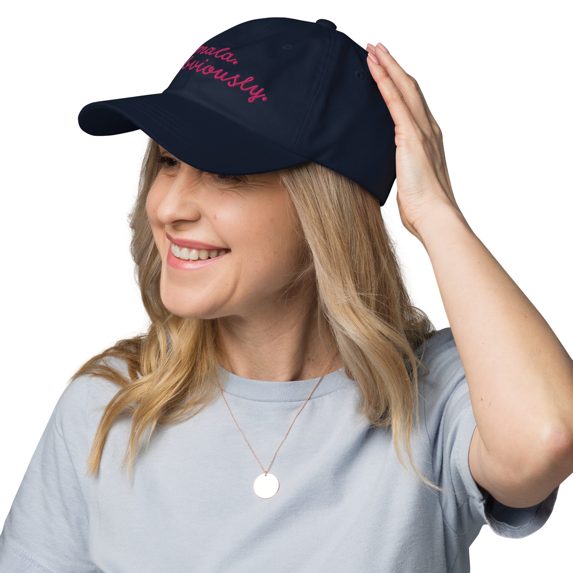 Smiling woman wearing Kamala Obviously embroidered navy cap