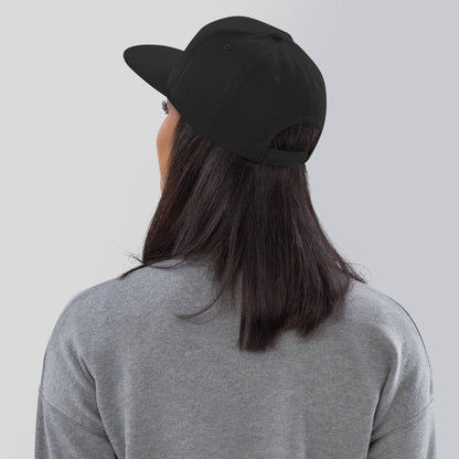 the back of a woman wearing a black hat