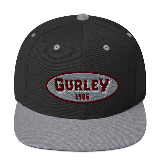 a black and grey hat with the word gurley on it