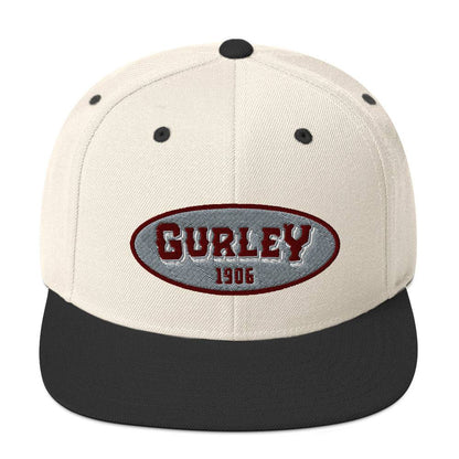 a white and black hat with the word gurley on it