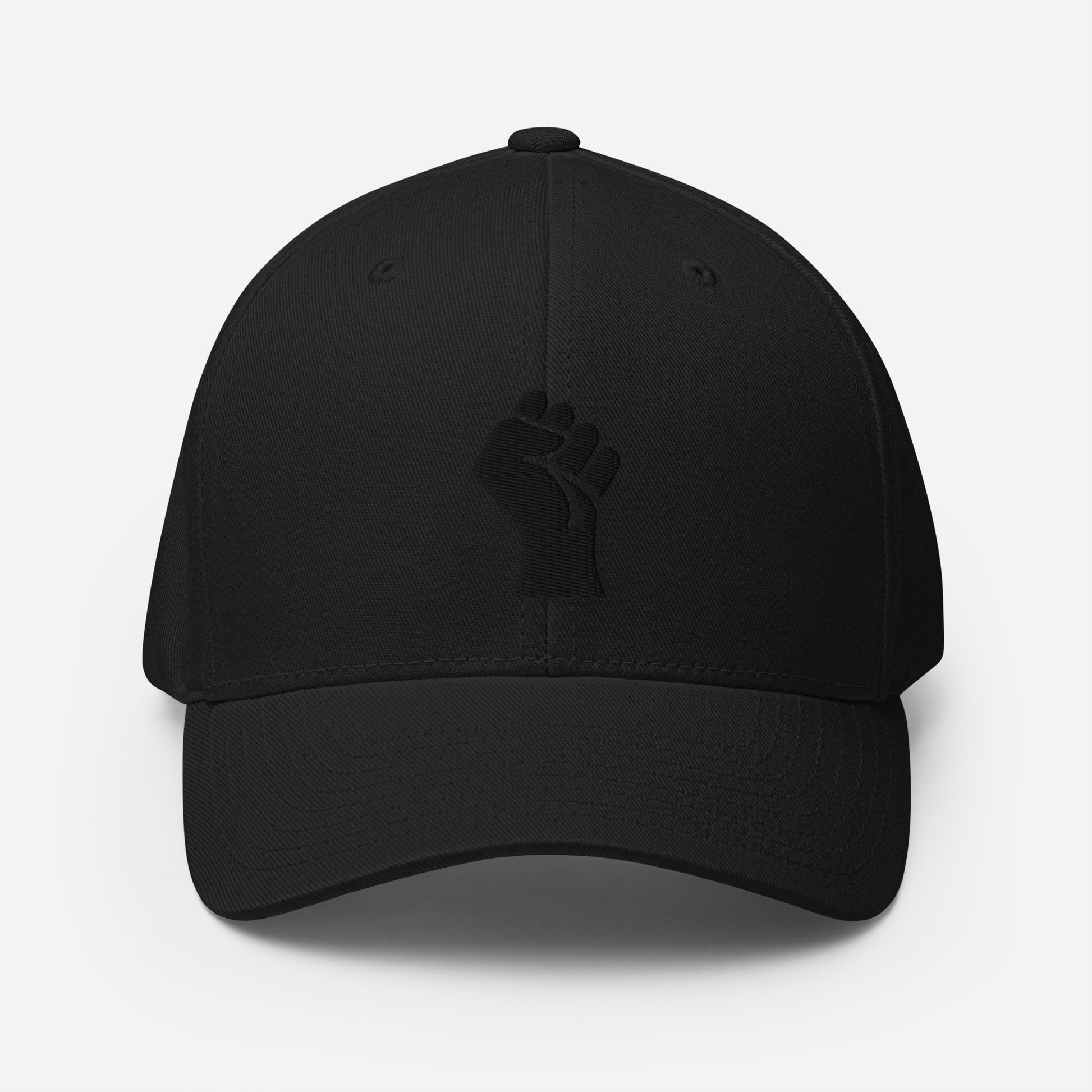 Black Flexfit structured cap with tonal black embroidered power fist, sleek and bold design by TheBlackest Co. for cultural pride.