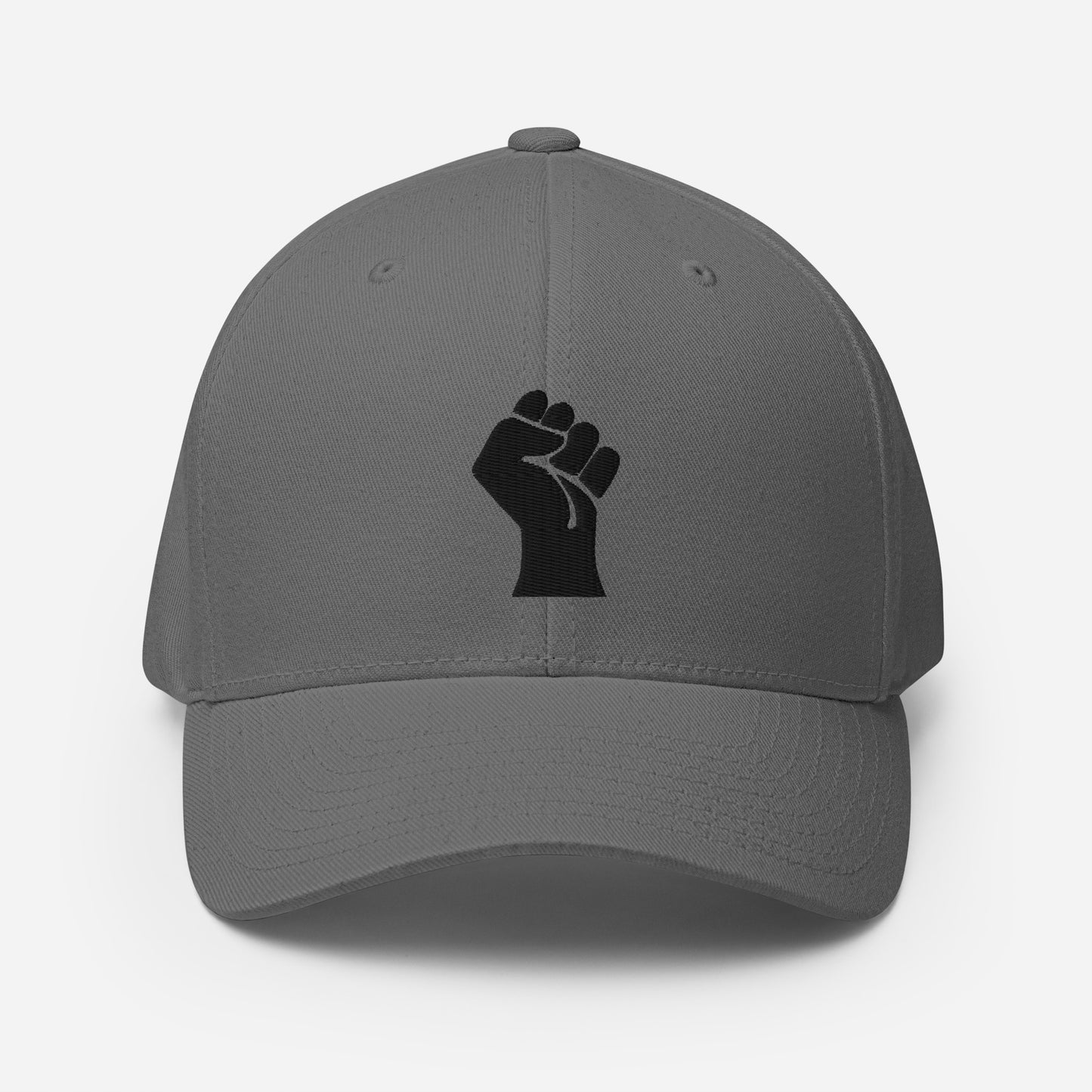 Light gray Flexfit structured cap with black power fist embroidery, combining minimalist style and cultural pride by TheBlackest Co.