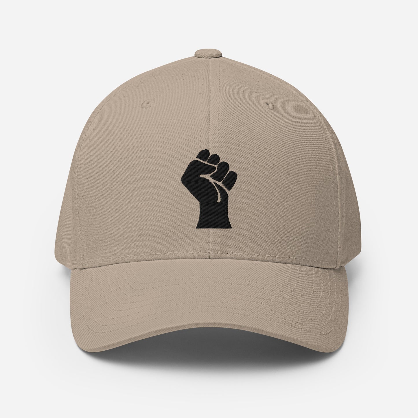 Beige Flexfit structured cap with black embroidered power fist, a neutral-toned cultural statement piece by TheBlackest Co.