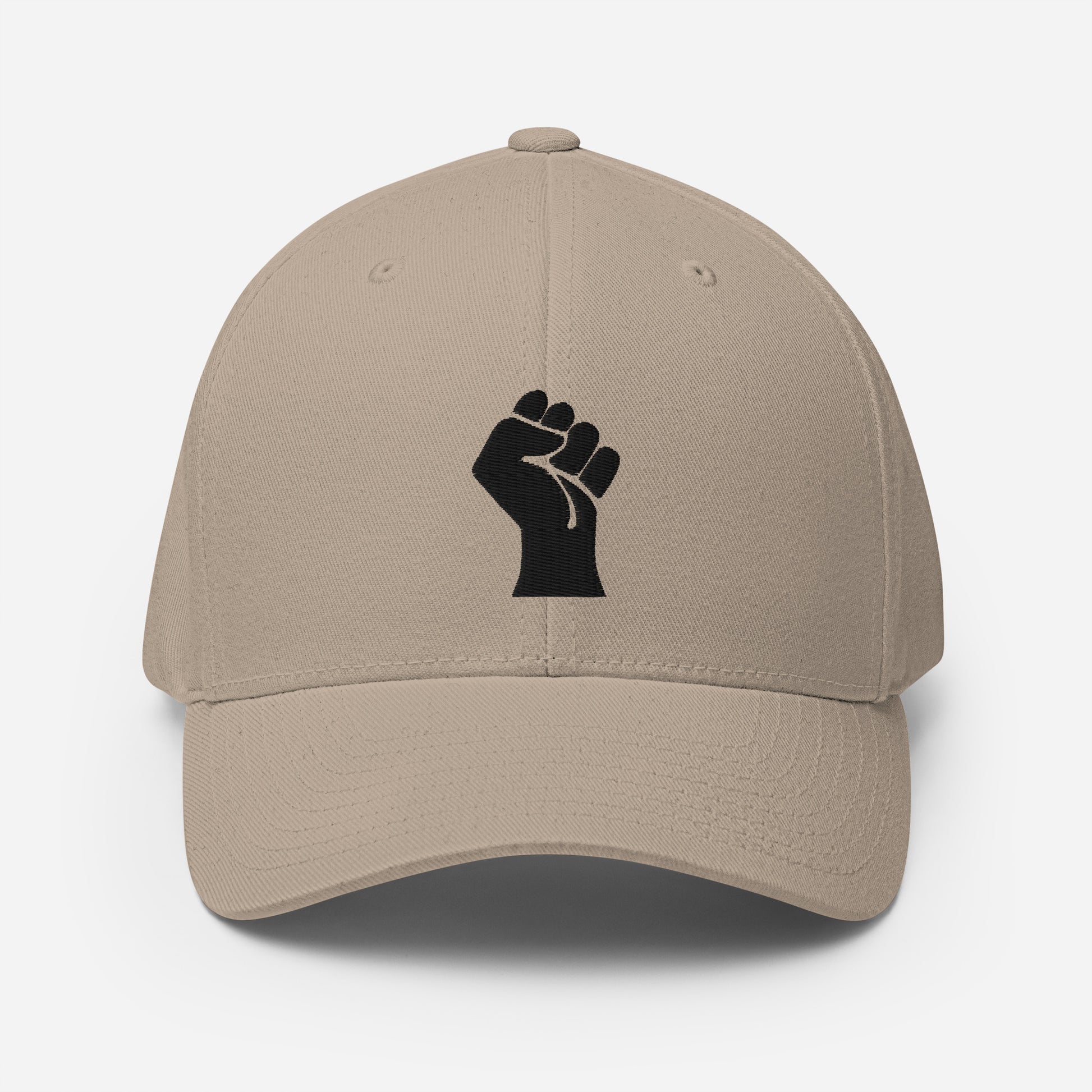 Beige Flexfit structured cap with black embroidered power fist, a neutral-toned cultural statement piece by TheBlackest Co.