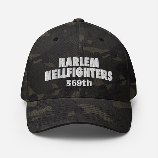 Front view of 369th Harlem Hellfighters Flexfit® Cap in black camo with bold white embroidery. Athletic fit with curved visor for modern style.