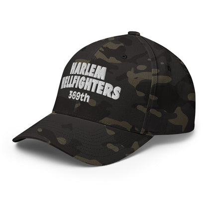 Side angle of Harlem Hellfighters 369th Flexfit® Cap in black camo. Features structured crown and stretch fit for comfort and durability.