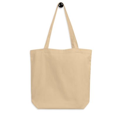 Close-up of beige organic cotton tote bag Black Panther Party Free Food back, eco-friendly shopping bag