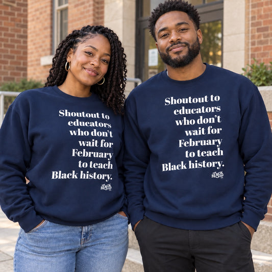 Close-up of navy blue unisex sweatshirt with printed message supporting Black history education, worn by a smiling couple outdoors.