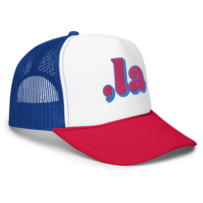 Side view of red and blue Retro Kamala embroidered trucker hat