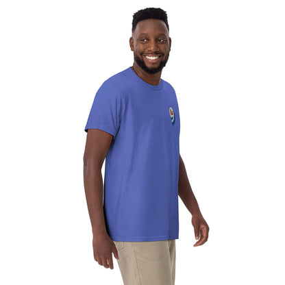 Man in light blue t-shirt with red white blue embroidery