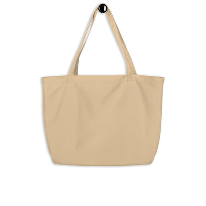 Close-up of beige tote bag with black logo and text