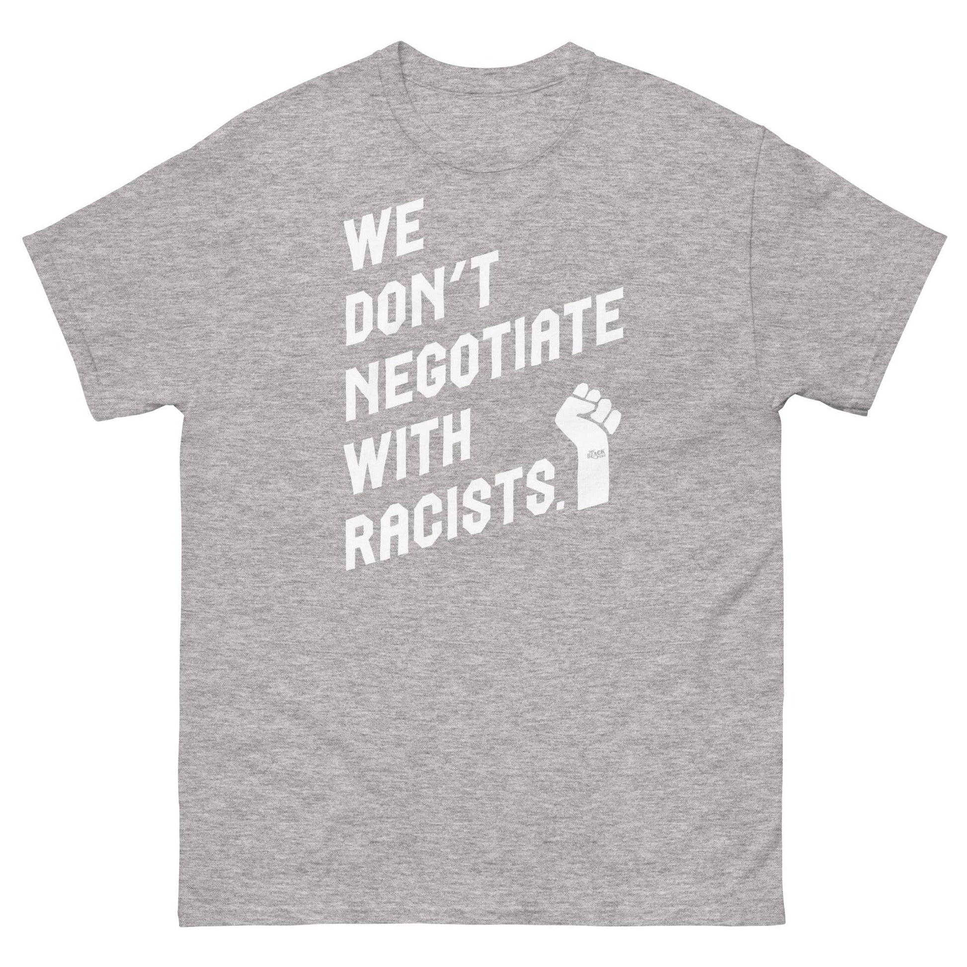 light gray t shirt with white lettering reading we don't negotiate with racists