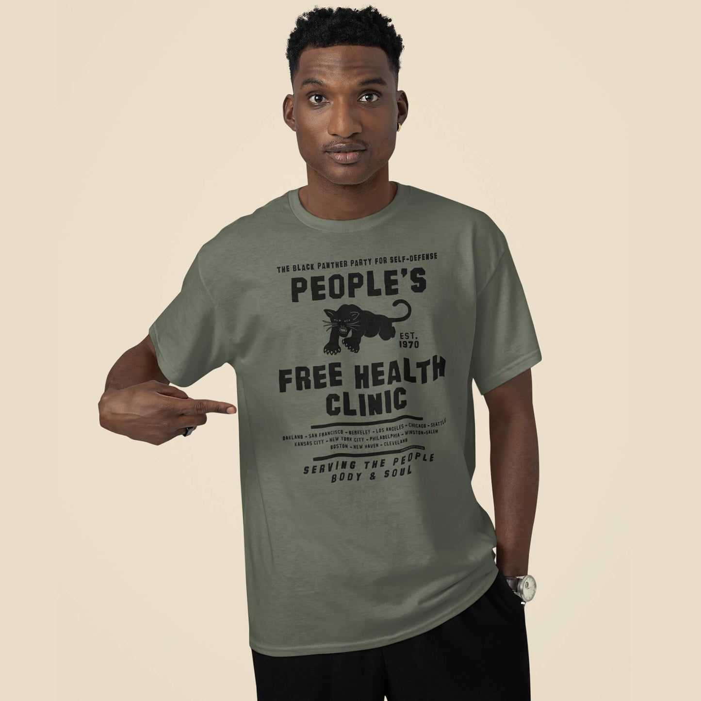 Model wearing green People's Free Health Clinic Black Panthers T-Shirt