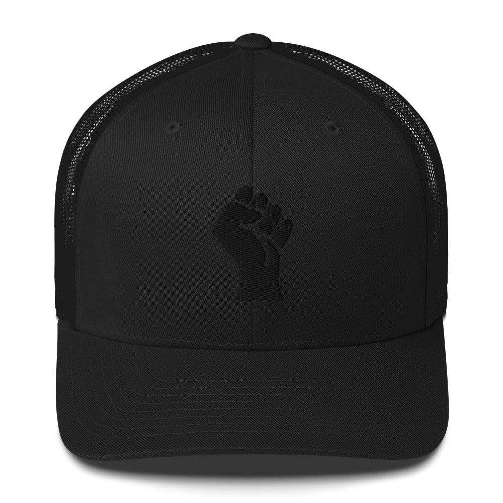 Front view of black embroidered Power Fist trucker cap