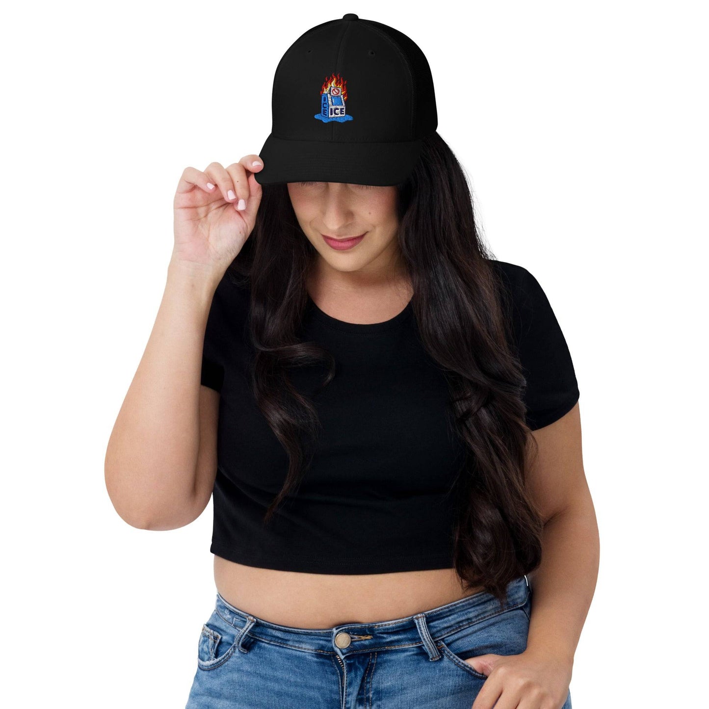 Woman wearing the Abolish ICE Burning Machine Trucker Hat by TheBlackest Co., showcasing breathable mesh back and bold protest design.