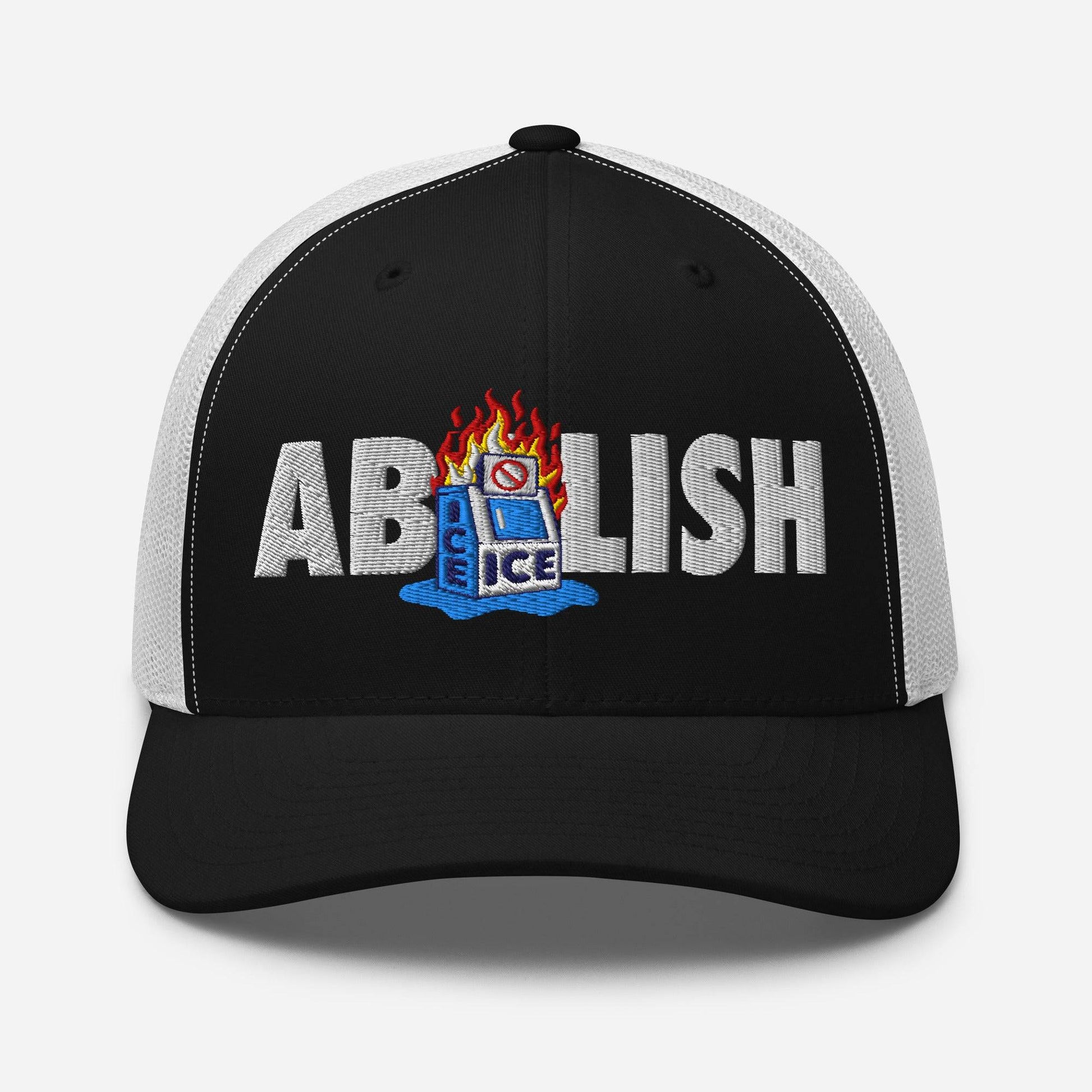Front view of black ABOLISH Burning ICE Machine Trucker Hat by TheBlackest Co. with bold embroidered protest message and mesh back.