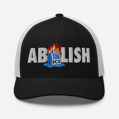 Front view of black ABOLISH Burning ICE Machine Trucker Hat by TheBlackest Co. with bold embroidered protest message and mesh back.