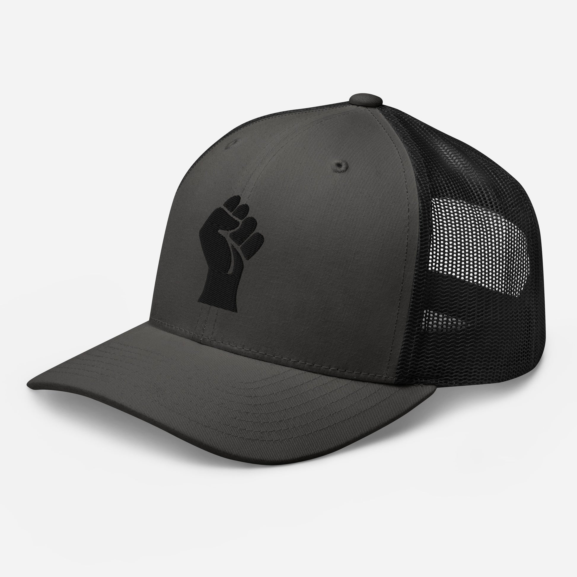 Side view of grey heather embroidered Power Fist trucker cap