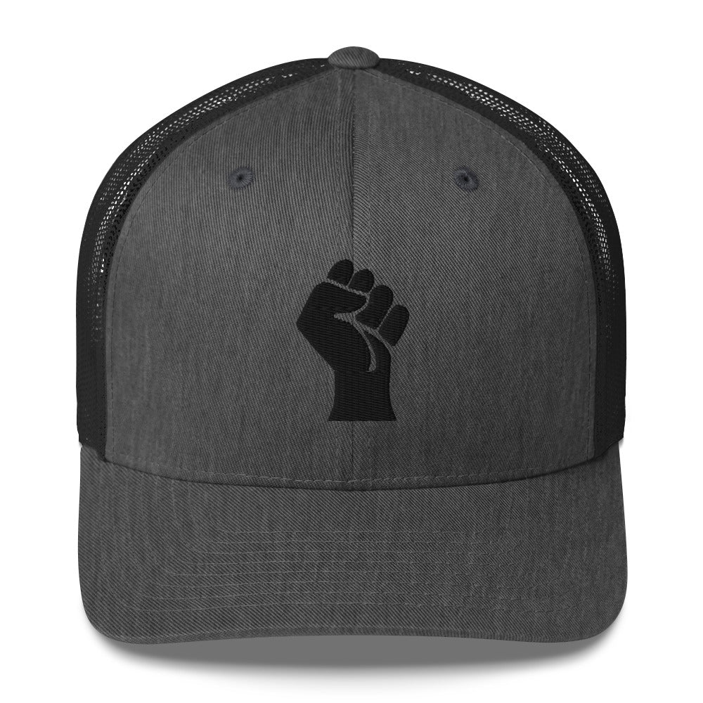 Front view of dark gray embroidered Power Fist trucker cap