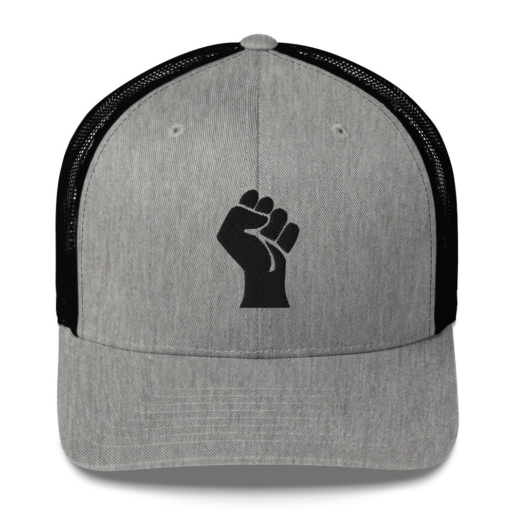 Front view of light gray embroidered Power Fist trucker cap