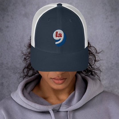 Front view of person in Red White Blue Comma La Harris Cap