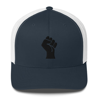 Front view of navy embroidered Power Fist trucker cap