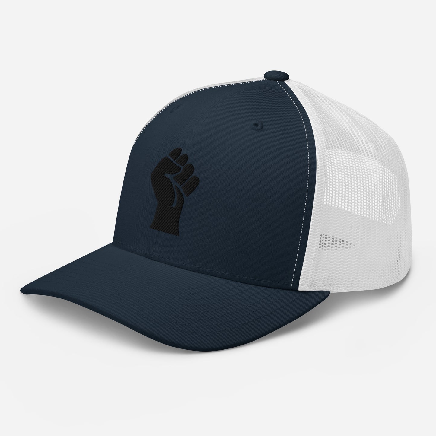 Side view of navy embroidered Power Fist trucker cap