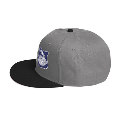 a grey and black hat with a white and purple rattlesnake crest on it with text that reads harlem hellfighters 369th infantry regiment