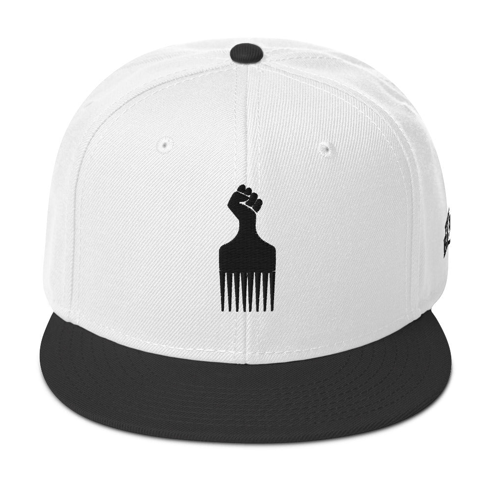 white and black snapback hat with raised fist pick and blackest co logo embroidery