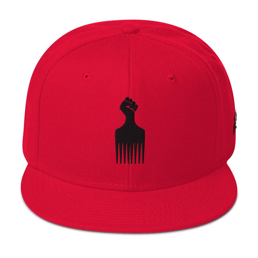 red snapback hat with raised fist pick and blackest co logo embroidery