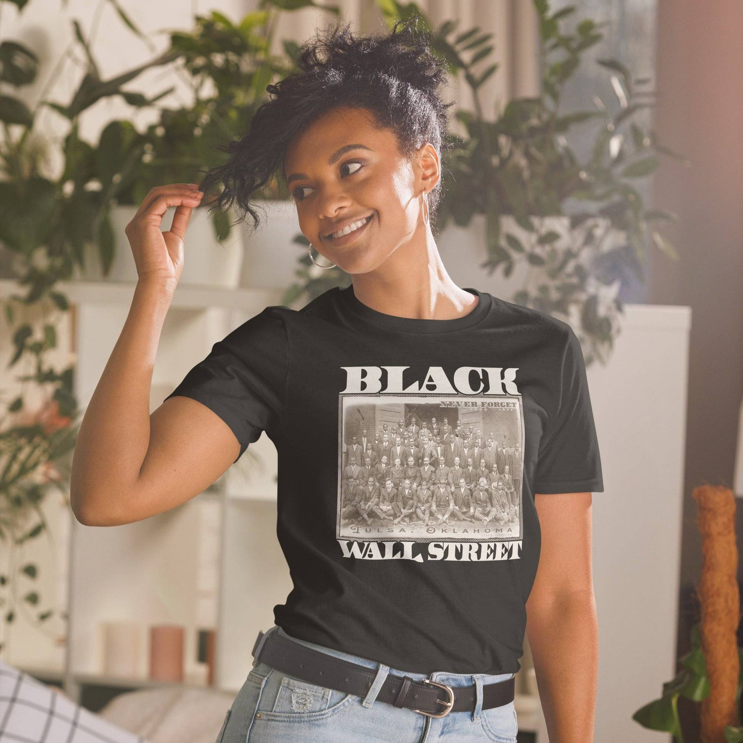 a woman wearing a black wall street t - shirt