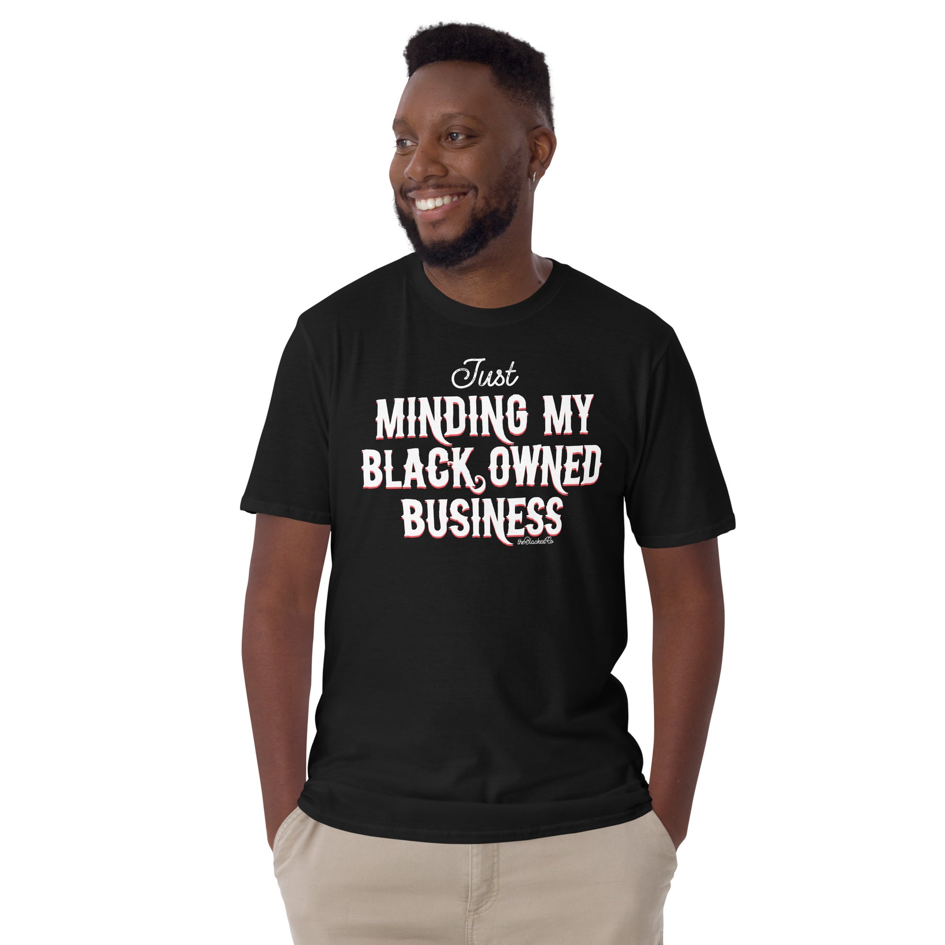 man wearing black t shirt with Just Minding My Black Owned Businesses design on it