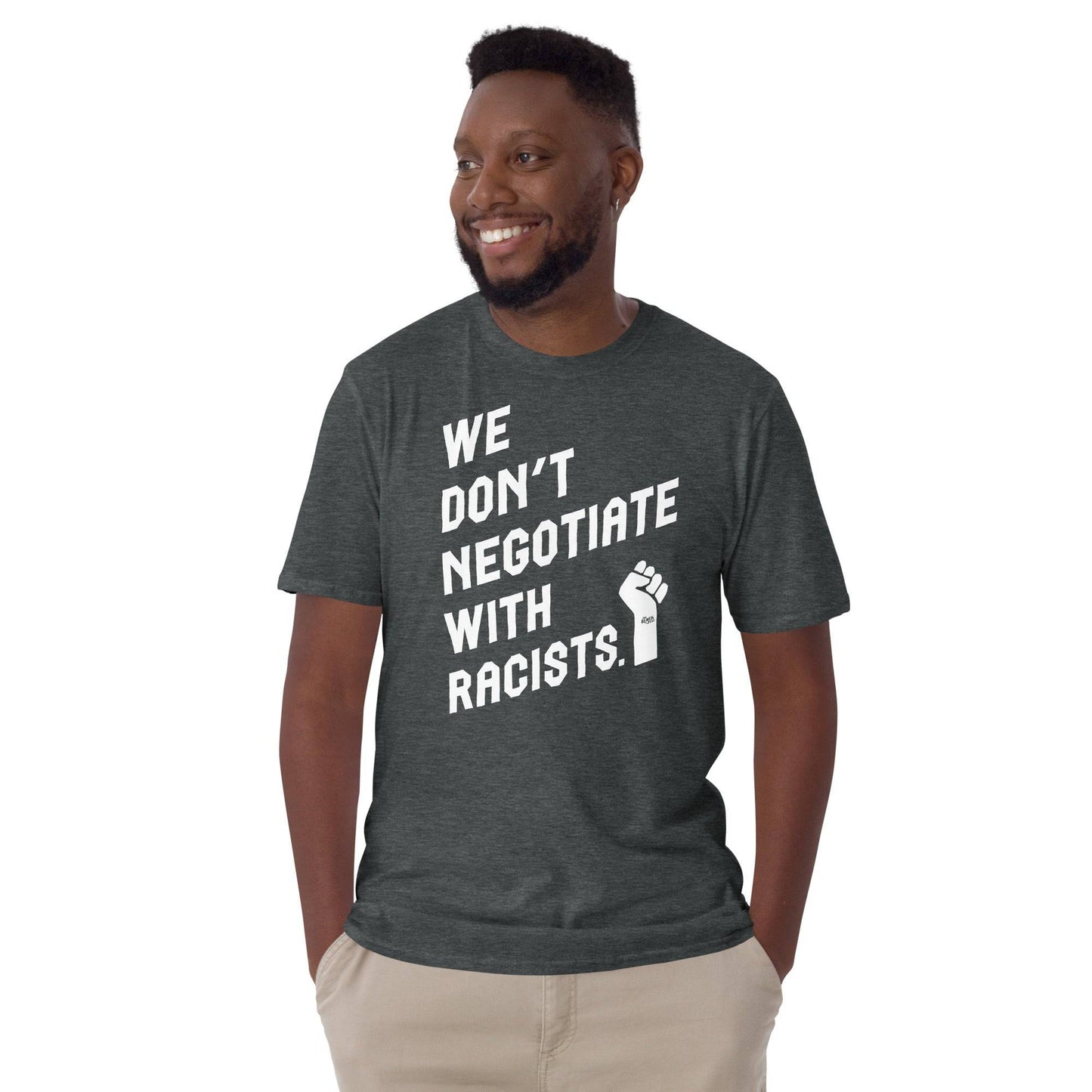 man wearing dark heather t shirt with white text reading we don't negotiate with racists