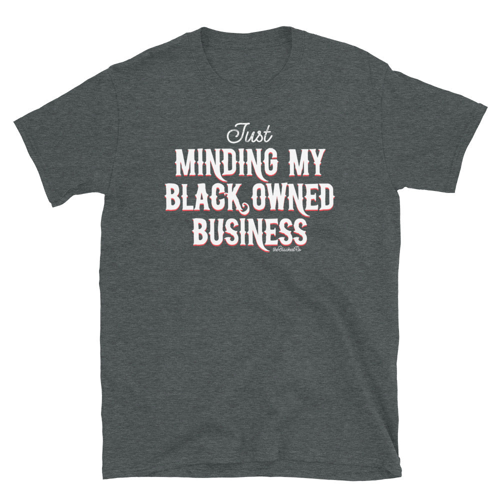 dark grey t shirt with Just Minding My Black Owned Businesses design on it