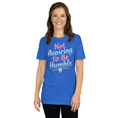 Smiling woman in blue 'Not Aspiring to Be Humble' shirt