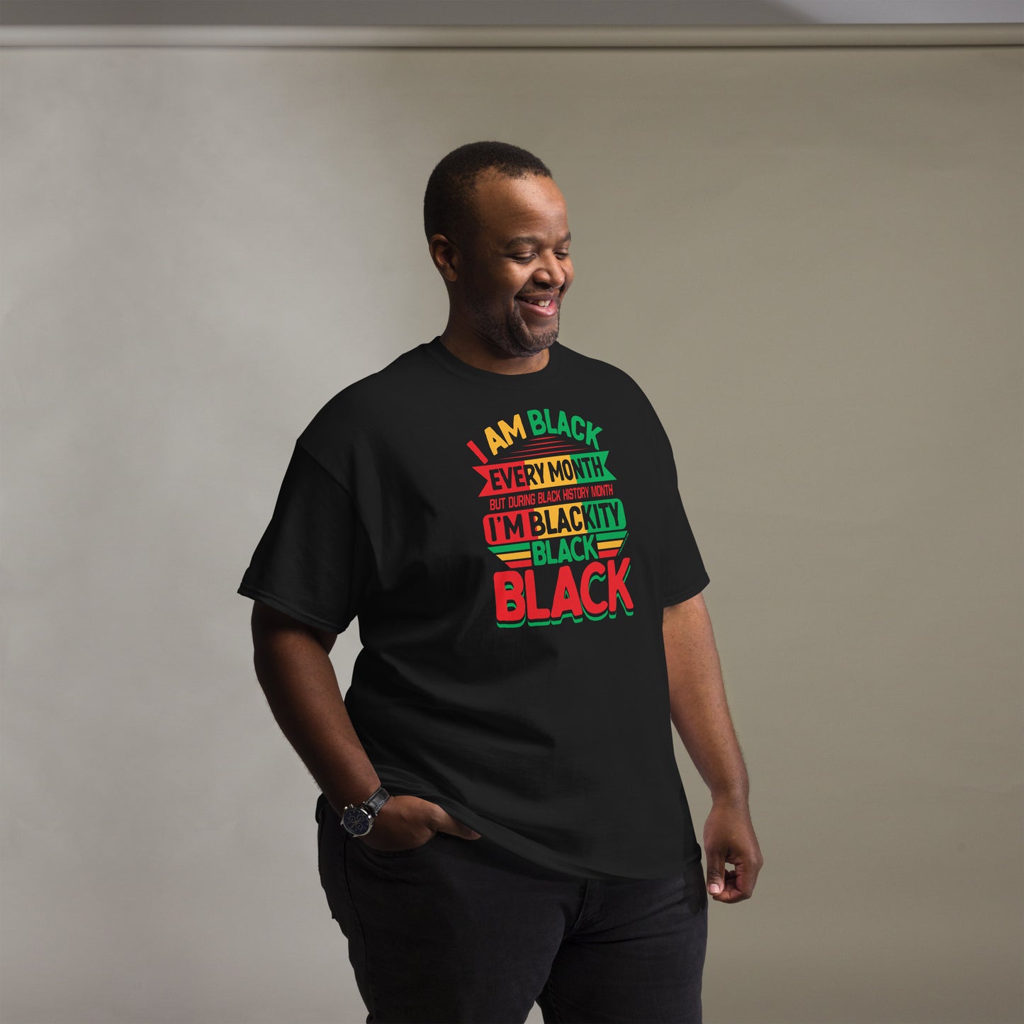 Man wearing the Blackity Black Black History Month Unisex T-Shirt by TheBlackest Co., showcasing a comfortable fit and vibrant design.