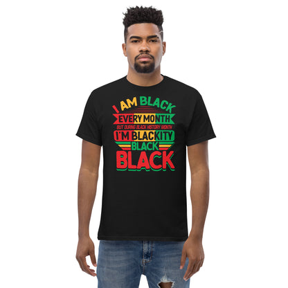 Model wearing the Blackity Black Black History Month Unisex T-Shirt by TheBlackest Co., featuring bold text in red, green, and yellow on black fabric.