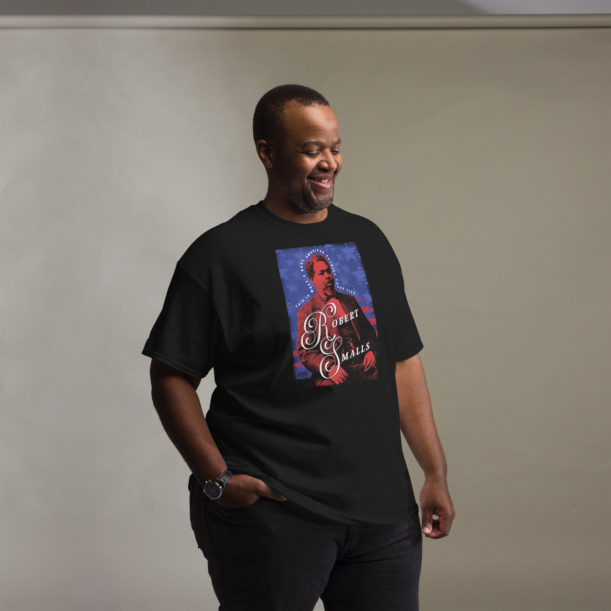 Smiling man wearing Robert Smalls Real American Patriot Unisex T-shirt by TheBlackest Co., celebrating Black history and legacy.