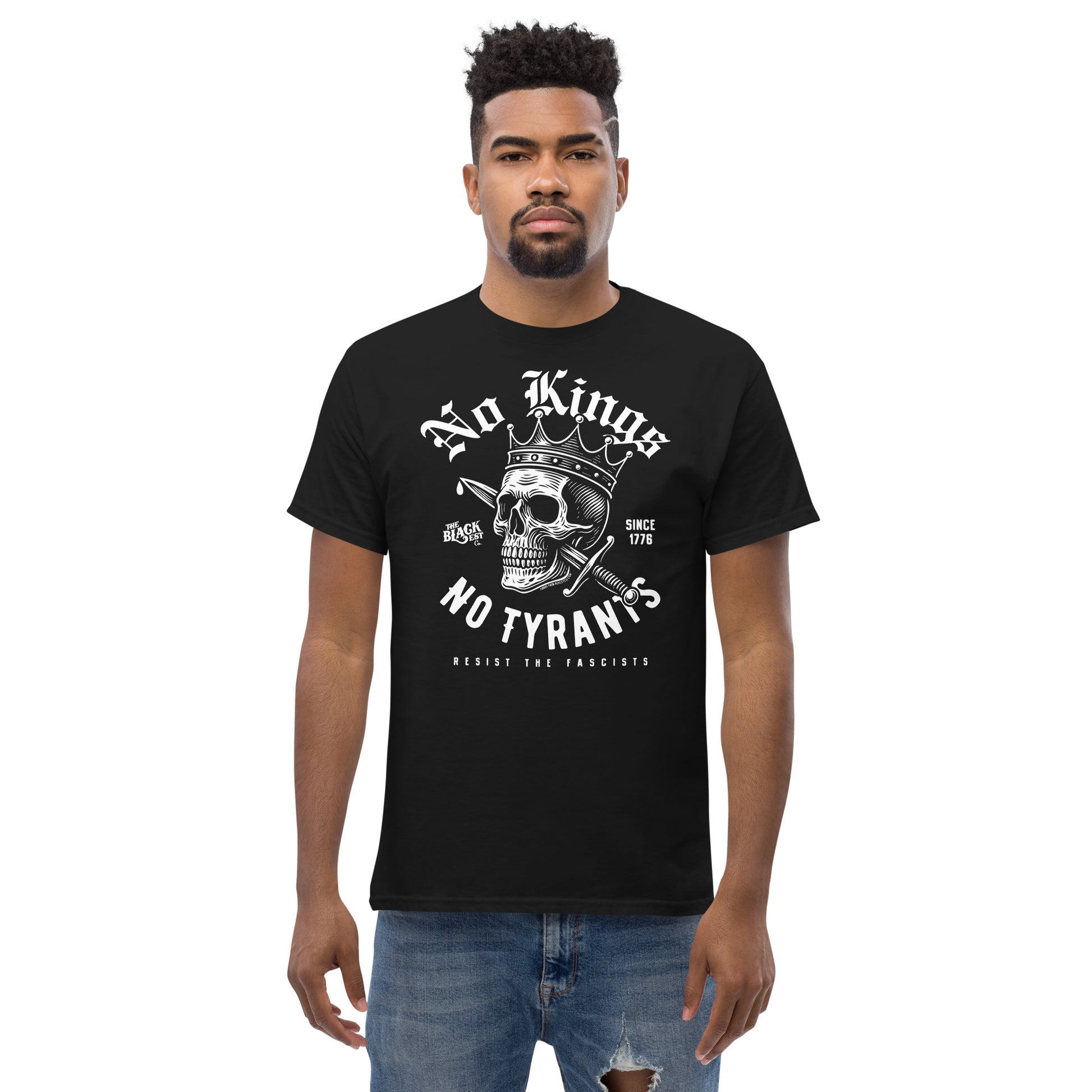 Man wearing No Kings No Tyrants Skull Protest T-Shirt by TheBlackest Co., black cotton tee with bold anti-tyranny skull design, streetwear fashion.
