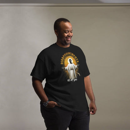 Man wearing Disappointments All Of You Black Jesus T-Shirt in black, showcasing bold cultural graphic and relaxed fit for streetwear style.